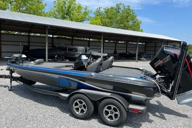 Slide: The Image of 2021 Nitro Z19 boat with dual seats and powerful engine, parked outdoors. - 6