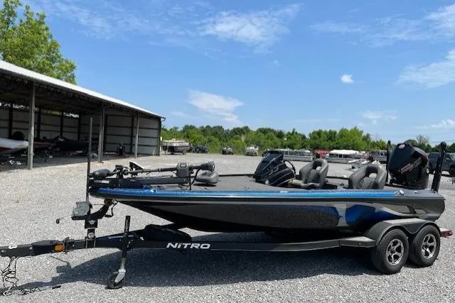 Slide: The Image of 2021 Nitro Z19 boat on trailer in outdoor storage area. - 7