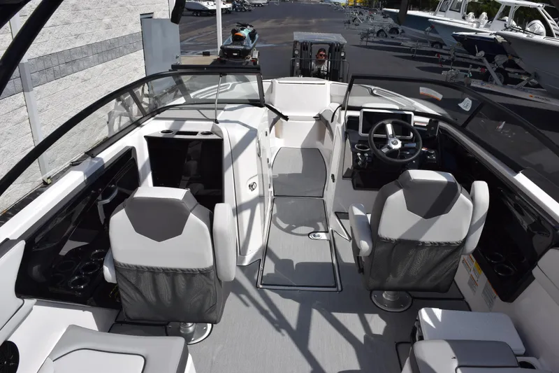 Slide: The Image of 2026 Yamaha Boats AR250 interior with modern seating and sleek dashboard design. - 10