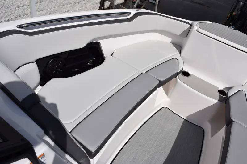 Slide: The Image of 2026 Yamaha AR250 boat interior with sleek seating and cup holders. - 17