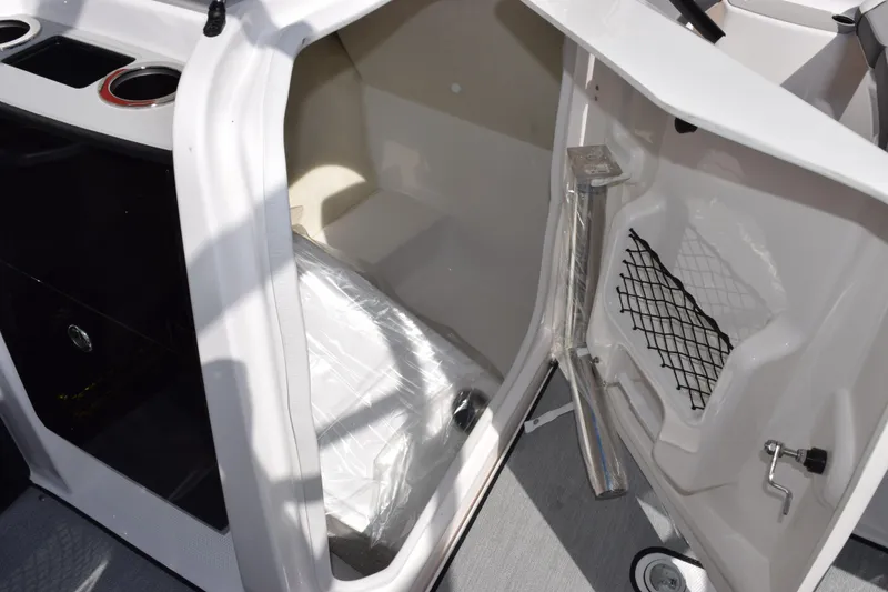 Slide: The Image of 2026 Yamaha AR250 boat storage compartment with open door and interior view. - 18