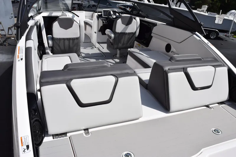 Slide: The Image of 2026 Yamaha Boats AR250 interior with modern seating and sleek design. - 7
