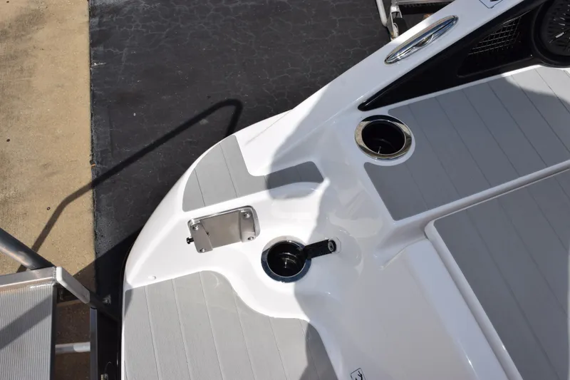 Slide: The Image of 2026 Yamaha Boats AR250 deck with cup holders and sleek design. - 9