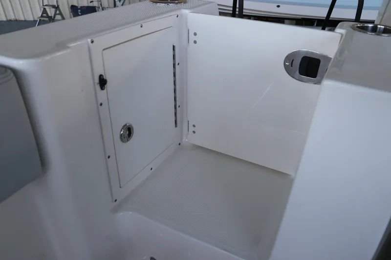 Slide: The Image of 2026 Robalo R250 Center Console boat interior storage compartment. - 11