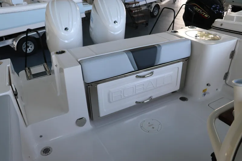 Slide: The Image of 2026 Robalo R250 Center Console boat interior with seating and storage. - 12