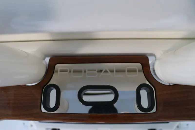 Slide: The Image of 2026 Robalo R250 Center Console boat detail with logo and wood accents. - 24