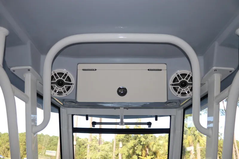 Slide: The Image of 2026 Robalo R250 Center Console interior with speakers and storage compartment. - 25