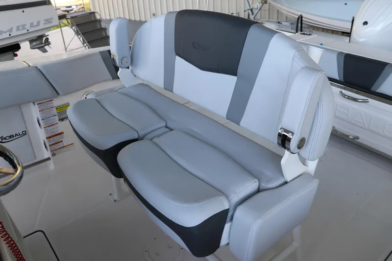 Slide: The Image of 2026 Robalo R250 Center Console boat seating, featuring sleek gray and white upholstery. - 39