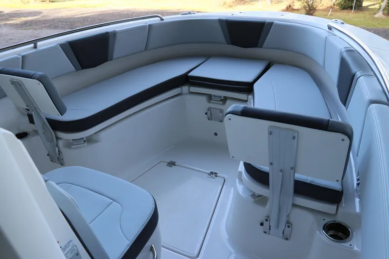 Slide: The Image of 2026 Robalo R250 Center Console boat interior with cushioned seating and storage. - 44