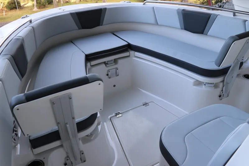 Slide: The Image of 2026 Robalo R250 Center Console boat interior with cushioned seating and storage compartments. - 45