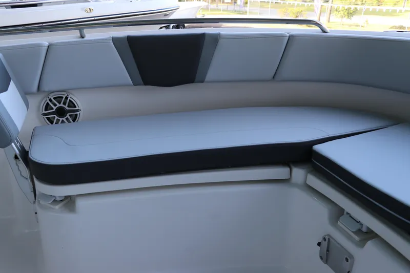 Slide: The Image of 2026 Robalo R250 Center Console boat interior seating with speaker detail. - 46