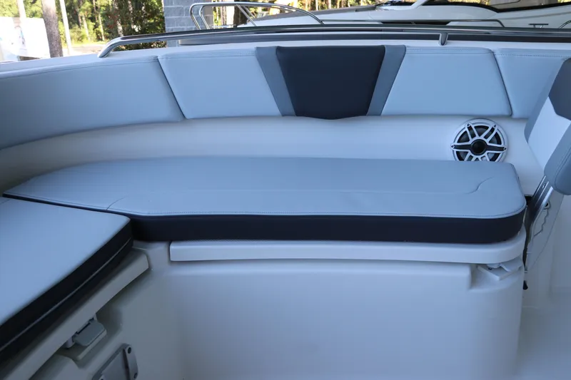 Slide: The Image of 2026 Robalo R250 Center Console boat interior with cushioned seating and speaker. - 47