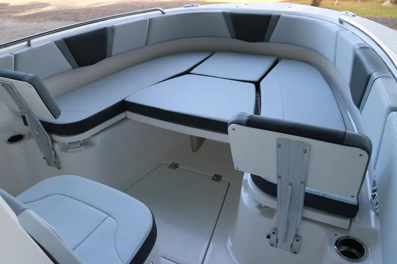 Slide: The Image of 2026 Robalo R250 Center Console boat interior with cushioned seating and modern design. - 48