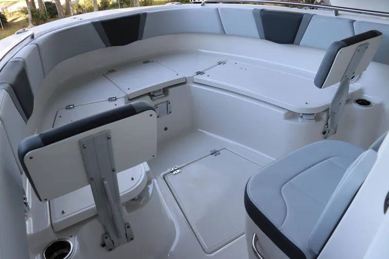 Slide: The Image of 2026 Robalo R250 Center Console boat interior with cushioned seating and storage compartments. - 53