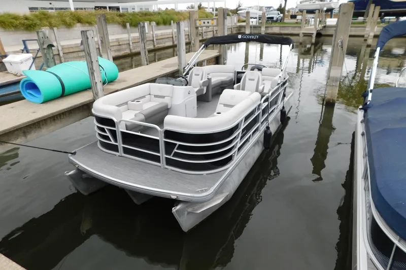 The Image of 2021 Godfrey Sweetwater 2286 SBX pontoon boat docked in marina. - 10