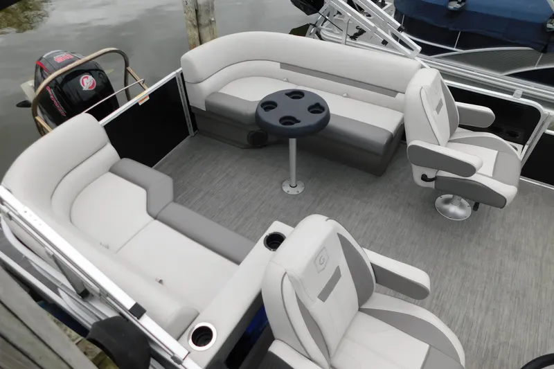 Slide: The Image of 2021 Godfrey Sweetwater 2286 SBX pontoon boat interior with seating and table. - 14