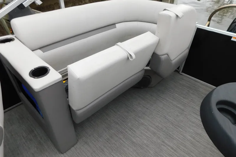 Slide: The Image of 2021 Godfrey Sweetwater 2286 SBX boat interior with gray seating and cup holders. - 19