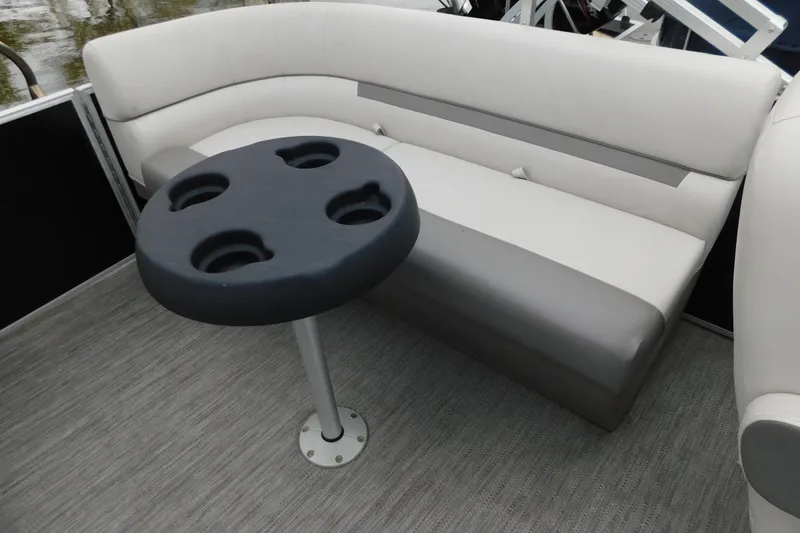 Slide: The Image of 2021 Godfrey Sweetwater 2286 SBX boat interior with seating and cupholder table. - 20