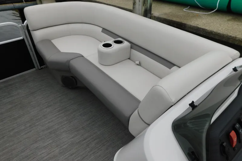 Slide: The Image of 2021 Godfrey Sweetwater 2286 SBX boat interior with plush seating and cup holders. - 24
