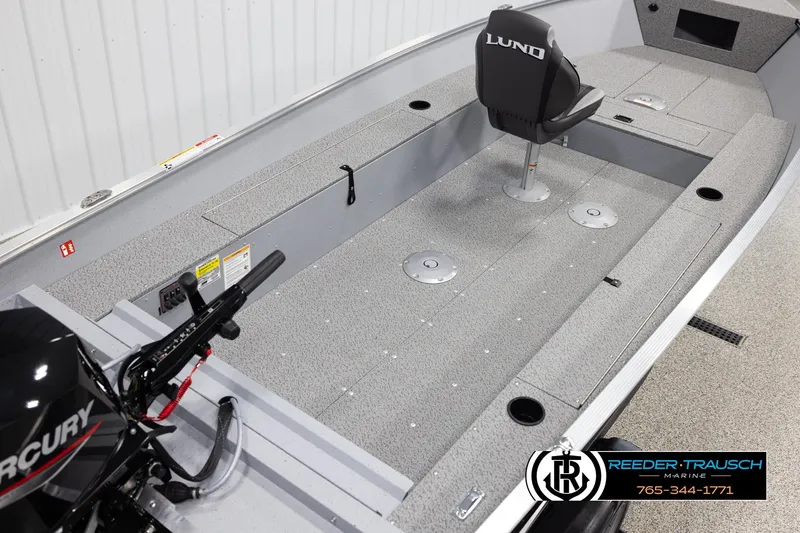 Slide: The Image of 2026 Lund 1600 Fury Tiller boat interior with Mercury engine and seating. - 10