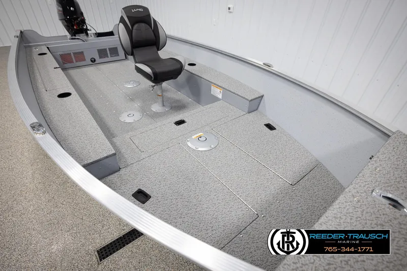 Slide: The Image of 2026 Lund 1600 Fury Tiller boat interior with seating and storage compartments. - 11