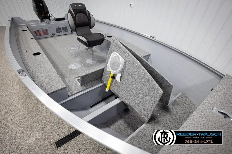 Slide: The Image of 2026 Lund 1600 Fury Tiller boat interior with seating and storage compartments. - 12
