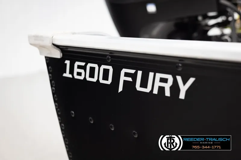 Slide: The Image of Close-up of 2026 Lund 1600 Fury Tiller boat with branding and logo. - 28