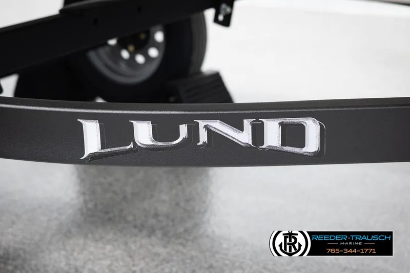 Slide: The Image of Lund 1600 Fury Tiller 2026 boat trailer with Reeder-Trausch Marine logo. - 29