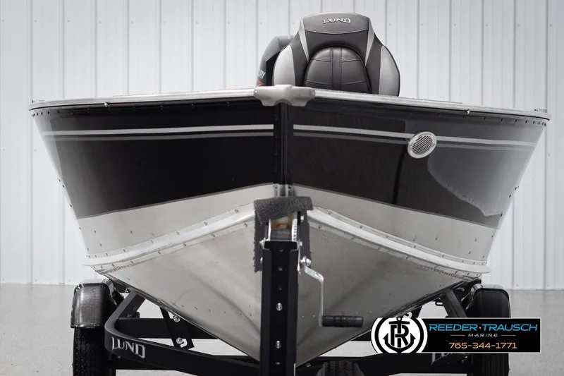 Slide: The Image of 2026 Lund 1600 Fury Tiller boat on trailer, front view, in showroom. - 6