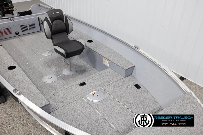 Slide: The Image of 2026 Lund 1600 Fury Tiller boat interior with seating and storage compartments. - 7