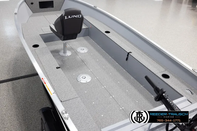 Slide: The Image of 2026 Lund 1600 Fury Tiller boat interior with seating and controls. - 9