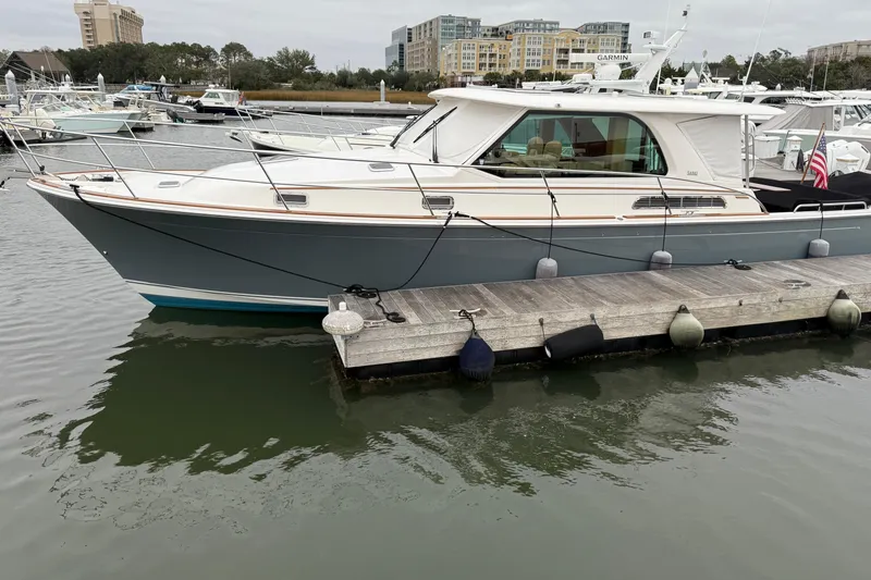 The Image of 2023 Sabre 43 Salon Express yacht docked at marina, showcasing sleek design and modern features. - 0