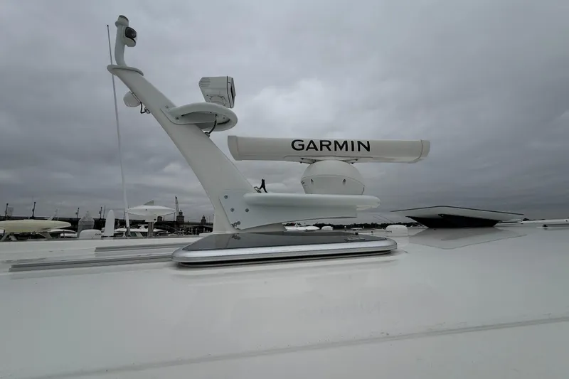 Slide: The Image of 2023 Sabre 43 Salon Express with Garmin radar on deck under cloudy sky. - 10