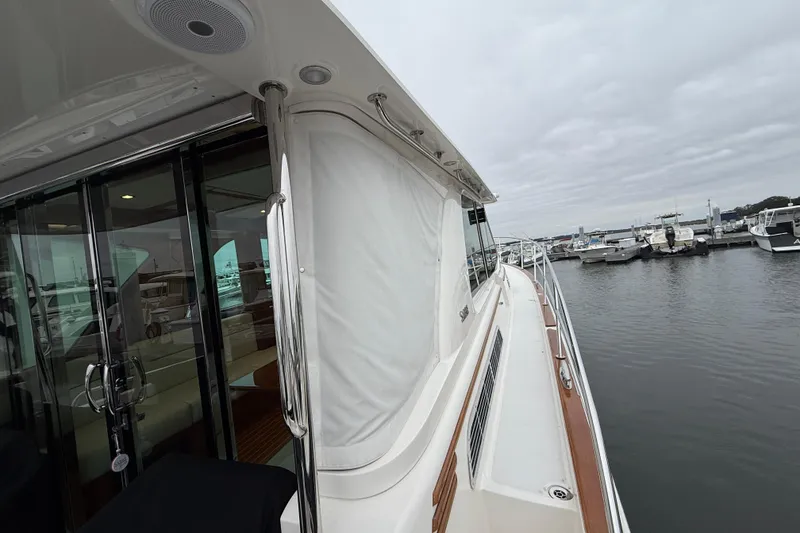 Slide: The Image of 2023 Sabre 43 Salon Express yacht docked at marina, showcasing sleek design and luxury features. - 101