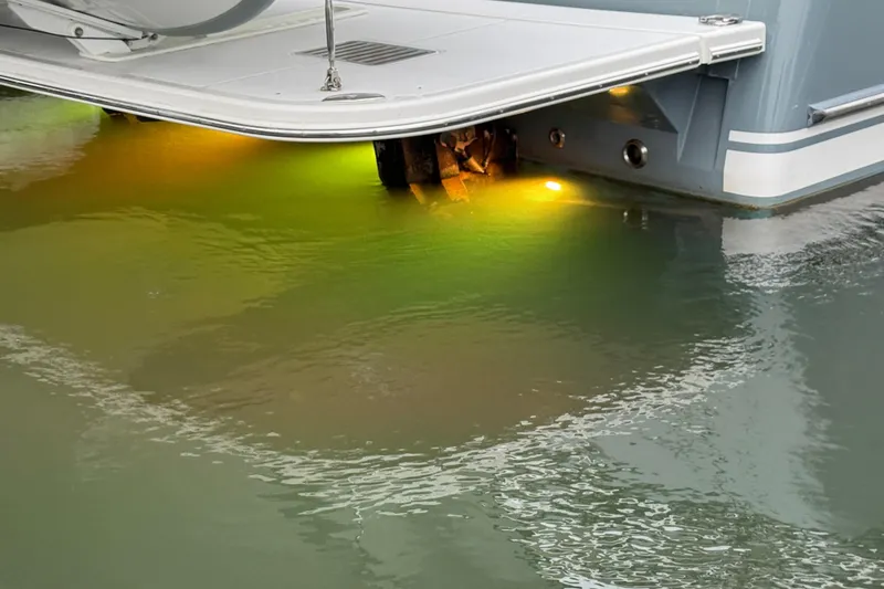 Slide: The Image of 2023 Sabre 43 Salon Express with underwater lights illuminating the water. - 115
