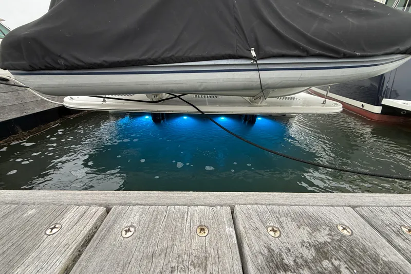 Slide: The Image of 2023 Sabre 43 Salon Express with blue underwater lights at dock. - 116