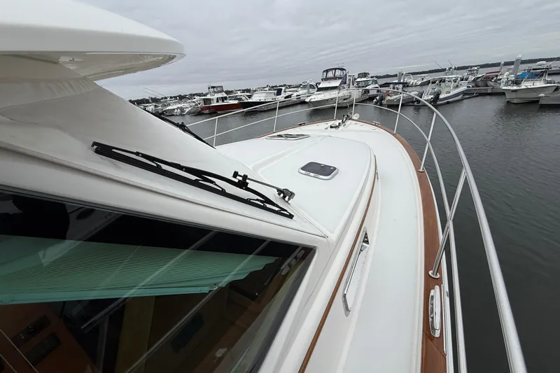 Slide: The Image of 2023 Sabre 43 Salon Express yacht docked at marina, showcasing sleek design and craftsmanship. - 13