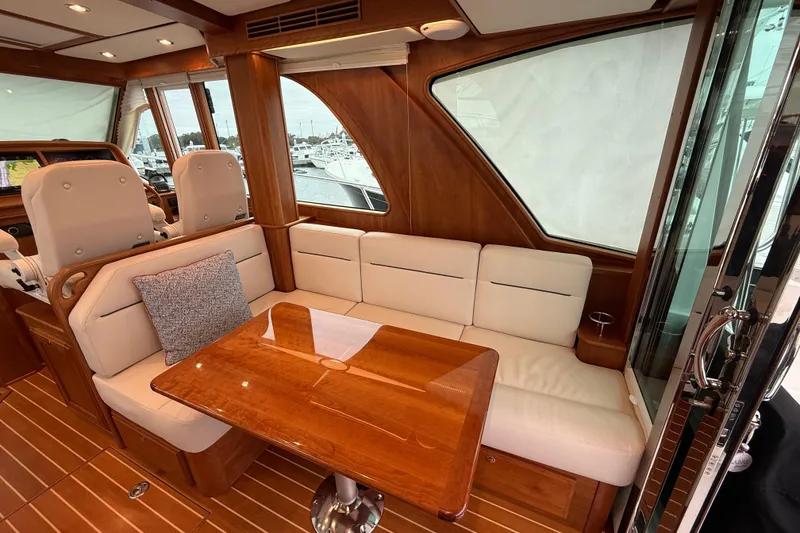 Slide: The Image of Luxurious interior of 2023 Sabre 43 Salon Express yacht with elegant seating and wooden table. - 27