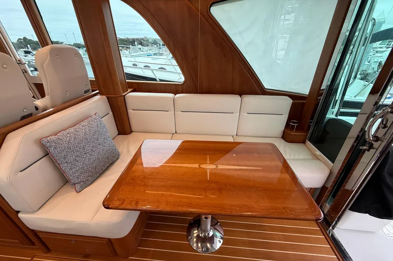 Slide: The Image of Interior of 2023 Sabre 43 Salon Express yacht with elegant seating and wooden table. - 30