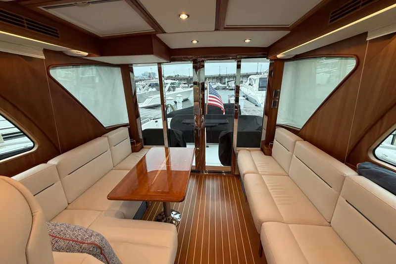 Slide: The Image of Luxurious interior of 2023 Sabre 43 Salon Express yacht with elegant seating and wooden accents. - 31