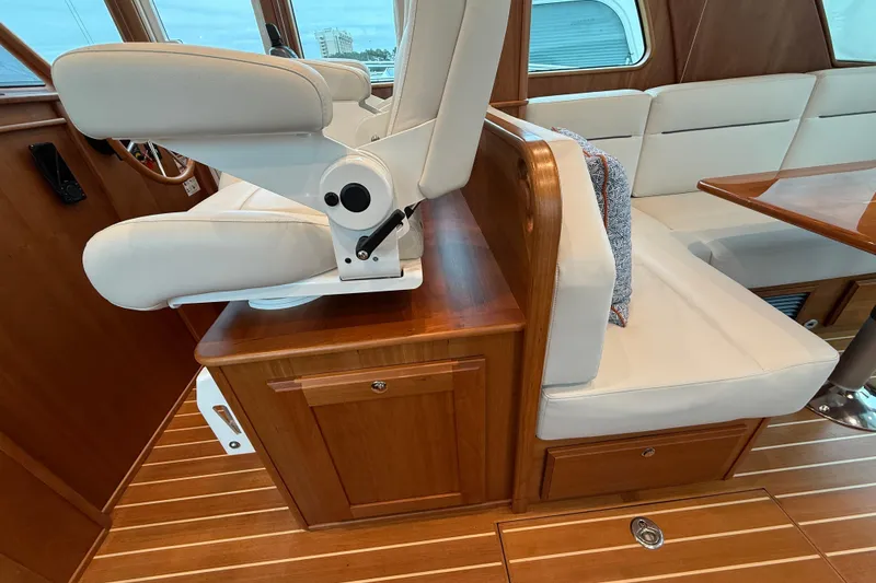 Slide: The Image of 2023 Sabre 43 Salon Express interior with white seating and wooden finishes. - 33