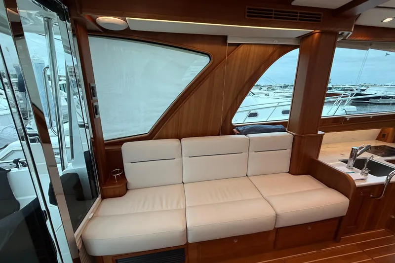 Slide: The Image of Luxurious interior of 2023 Sabre 43 Salon Express yacht with white seating and wooden accents. - 37