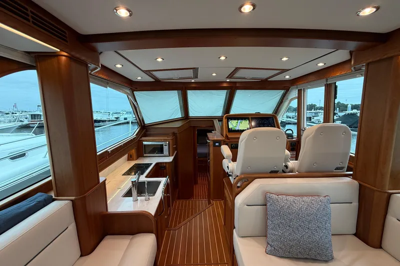 Slide: The Image of Interior of 2023 Sabre 43 Salon Express yacht with luxurious seating and navigation area. - 38