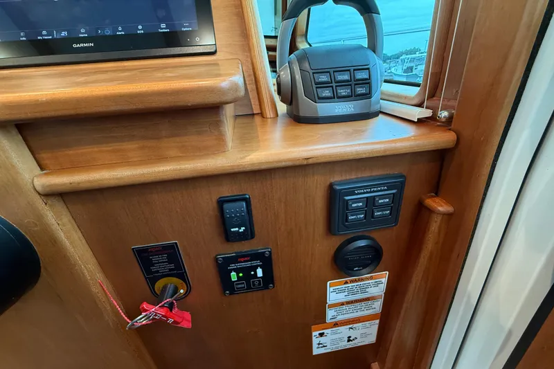 Slide: The Image of 2023 Sabre 43 Salon Express helm controls with Garmin display and Volvo Penta joystick. - 47
