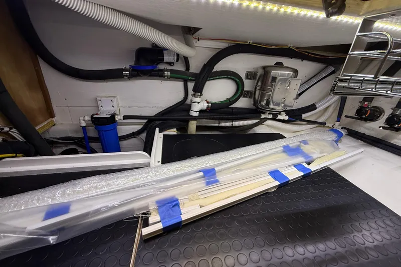 Slide: The Image of Engine room of 2023 Sabre 43 Salon Express with pipes and equipment. - 52