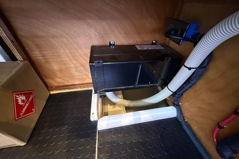 Slide: The Image of 2023 Sabre 43 Salon Express interior with electrical components and flammable liquid warning. - 55