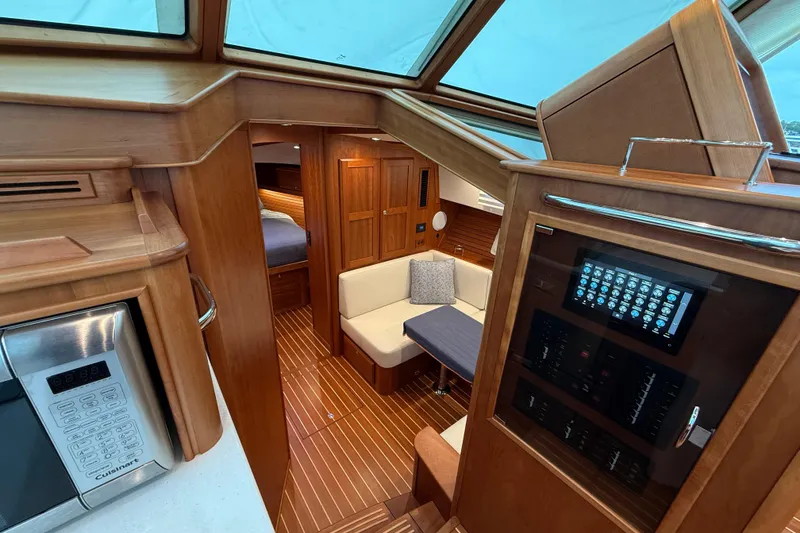 Slide: The Image of Interior of 2023 Sabre 43 Salon Express yacht, featuring wood finishes and modern amenities. - 57