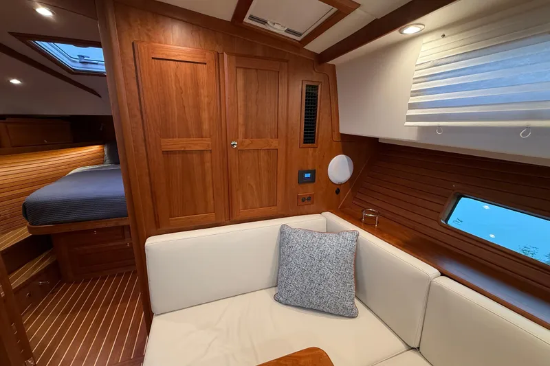 Slide: The Image of Luxurious interior of 2023 Sabre 43 Salon Express yacht with wood finish and cozy seating. - 65