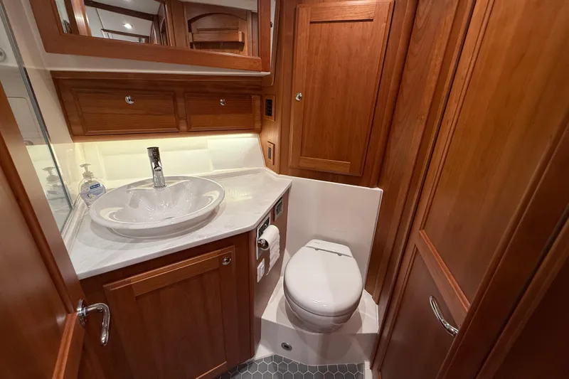 Slide: The Image of Luxurious 2023 Sabre 43 Salon Express bathroom with wooden cabinetry and modern fixtures. - 69