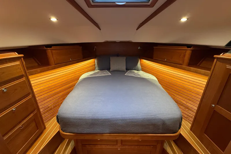 Slide: The Image of Luxurious cabin interior of 2023 Sabre 43 Salon Express yacht with cozy bed and wooden finish. - 72